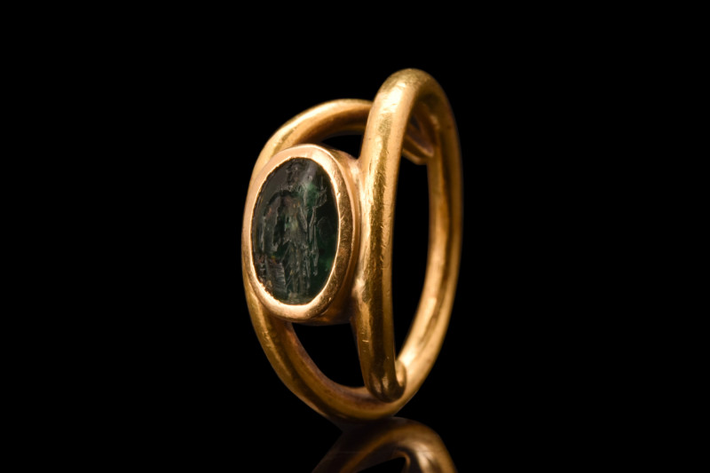 Ca. 200-300 AD.
An oval-shaped emerald intaglio that is engraved with a depictio...