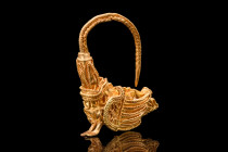 Ca. 350 BC.
A breathtaking gold earring with its highly decorative shank, comprised of twisted and ribbed wires. At one end of the shank is a harpy te...