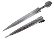 Ca. early 20th century AD.
Silver mounted dagger with hilt and scabbard decorated in chiseling niello, straight double-edged blade with two fullers on...