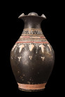 Ca. 340-320 BC.
A black-glaze jug distinguished by its refined form and intricate decoration. It takes the shape of an oinochoe, a type of ancient Gre...