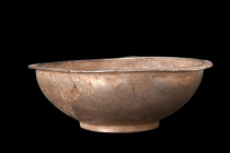 Ca. 4th-3rd century BC.
A silver libation bowl, skillfully crafted from silver. The bowl's distinctive characteristics include its hemispherical shape...