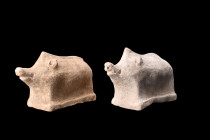 Ca. 400-300 BC.
A pair of pottery pigs. Each of these figurines displays simplified features and is attached to an integral flat base with a rectangul...