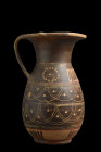 Ca. 700-600 BC.
A pottery vessel formed in brown, black, and red with incised decoration, the ovoid body with linear bands and rays emerging from the ...