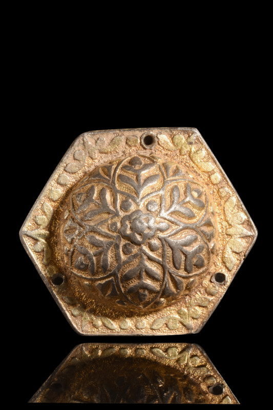 Ca. 300-400 AD.
A silver gilt phalera. Its form, a symphony of geometry, unveils...