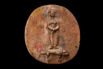 Ca. 100-300 AD.
A bronze plaque characterized by its roundish shape and the intricate relief decoration adorning its upper face. The central focus of ...
