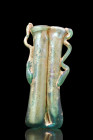 Ca. 300 AD.
A beautiful double balsamarium crafted from greenish glass. The vessel is composed of two conjoined tubular phials with slightly flared an...