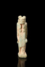 Late Period, ca. 664-332 BC.
A glazed composition amulet depicting the goddess Tawaret standing in a confident posture, with arms held at the sides of...
