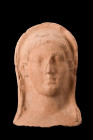 Ca. early 5th century BC.
A rare terracotta protome, featuring a breathtaking visage of a goddess with ethereal beauty. This masterful creation showca...