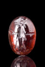 Ca. 1st century AD.
A convex intaglio adorned with a finely engraved depiction of the esteemed goddess Minerva, known as Athena in Greek mythology. Th...