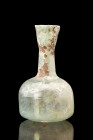 Ca. 100-300 AD.
A glass vessel with a captivating combination of form and function. Its squat globular lower body, expertly crafted, provides stabilit...