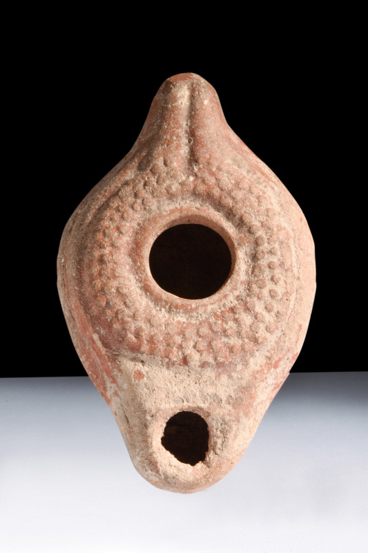 Ca. 100-200 AD.
A terracotta oil lamp, characterized by its ovoid shape that exu...