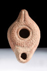 Ca. 100-200 AD.
A terracotta oil lamp, characterized by its ovoid shape that exudes understated elegance. The lamp features a short, rounded spout tha...