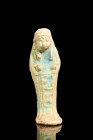 Late Period, ca. 664-332 BC.
A light faience ushabti. This mummiform figurine stands atop a diminutive, level base, with its hands gracefully crossed...