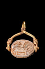 Ca. 664-332 BC.
A steatite Egyptian scarab with incised features and hieroglyphs to the reverse. The front anatomy features a detailed head and clypeu...