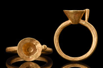 Ca. 100-300 AD.
A gold finger ring with a round hoop and trumpet-shaped bezel. These bezels were typically designed to accept an insert, such as a gem...