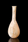 Ca. 1-300 AD.
A glass unguentarium featuring a beautiful piriform shape with a long, tubular neck. This flask would have been used to store and apply ...