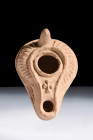 Ca. 600 AD.
A pottery oil lamp featuring a pear-shaped reservoir with its focal point residing in the center – a filling aperture encircled thoughtful...
