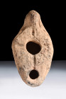 Ca. 400-600 AD.
A pottery oil lamp with an elegantly rendered pear-shaped body, distinguished by its central orifice designated for the introduction o...