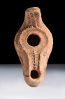 Ca. 300-500 AD.
A pottery oil lamp with a distinctive convex body that gently curves, creating an elegant yet functional design. The meticulous artist...