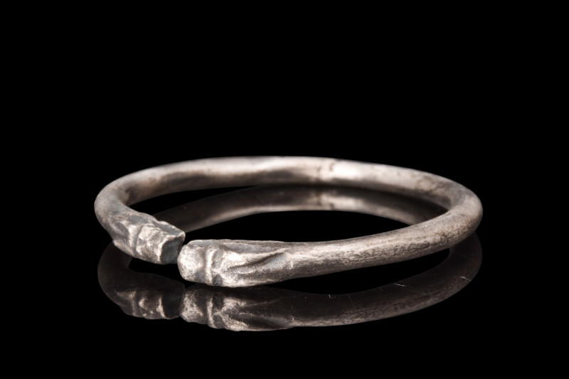Ca. 4th-3rd century AD.
Crafted from silver, this bracelet follows the penannula...