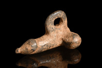 Ca. 100-200 AD.
A bronze pendant exquisitely cast in the unmistakable form of a phallus, exhibits stylized testicles and a suspension loop, underscori...