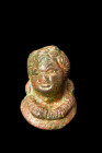 Ca. 100-300 AD.
A bronze bust of a youthful male with distinct features. The chubby face and rounded cheeks lend an air of innocence, while the accent...