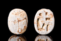 Ca. 1390-1352 BC.
Egyptian white steatite scarab with inscribed hieroglyphs to the reverse, detailing a seated goddess holding the 'ankh' symbol for l...