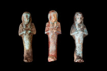 Late Period, 30th Dynasty, Ca. 332 BC.
A group of three ushabtis, fashioned from the light blue glazed composition. These small funerary figurines wer...