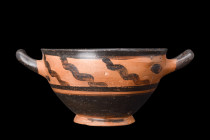Ca. 5th-4th century AD.
A pottery skyphos created from a fine clay material, reflecting the exceptional craftsmanship of ancient Greek potters. It fea...