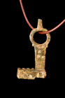 Ca. 100-300 AD.
A bronze key featuring a circular suspension hoop with a lateral projection, providing a point of attachment and ease of handling. A r...