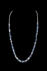 Ca. 1000-1500 AD.
A restrung necklace composed of round and tubular blue glass beads. The choice of blue glass reflects the profound influence of Isla...