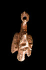 Ca. 1st century AD.
A bronze figurine of an eagle with its wings held back, grasping a head of a bull in its claws while holding a wreath in its beak....