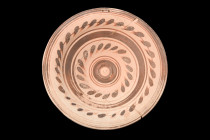 Ca. 300 BC.
A pottery plate featuring a round body with a convex cavity, perfectly suited for serving and presenting food. The elevated ring foot prov...