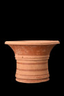 Ca. 300 BC.
A beautifully shaped kalathos characterized by a concave ringed base, a truncated cone body, a wide mouth, and a flared rim. The exterior ...