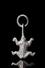 Ca. 300-100 BC.
A silver frog amulet, crafted with meticulous detail. This captivating piece features a stylized representation of a frog, with its le...