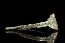 Ca. 1st century AD.
A bronze Aucissa brooch with its form unfolding in an elegant interplay of elements, where a semi-circular bow asserts its presen...