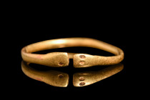 Ca. 1st century AD.
A gold finger ring of open type. The shank, a round testament to proportion, gently deviates from perfect circularity, affording i...