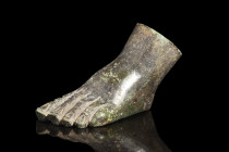 Ca. 100-300 AD.
A bronze left foot, meticulously sculpted and hollow, showcasing an intricate rendition of fingers complete with discernible nails and...