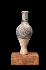 Ca. 200-100 BC.
A pottery unguentarium with its spindle form body is elegantly shaped, with a stem foot and flared base that provide stability and bal...
