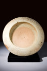 Ca. 300 BC.
A terracotta dish crafted with precision and finesse. The plate's low foot elevates it above the ground, while the rounded flange lends a ...