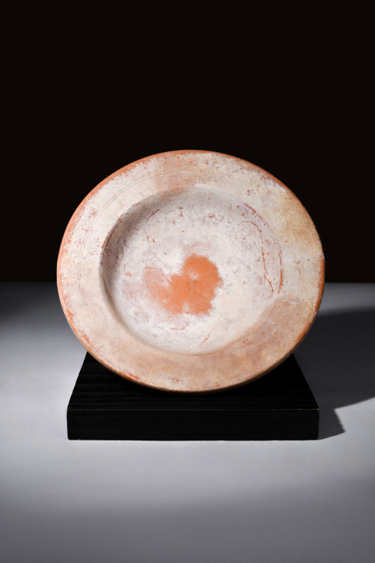 Ca. 100-300 AD.
A redware plate, a confluence of artistry and functionality, com...