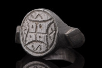 Ca. 100-300 AD.
A bronze finger ring with a hoop crafted from a shank that is flat on the inside and rounded on the outside. The shoulders of the ring...