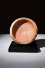 Ca. 3rd-1st century BC.
A terracotta dish with a round and shallow body. The gently rounded base provides stability, a foundation upon which the dish'...