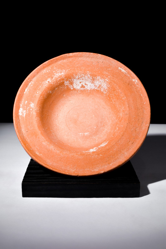 Ca. 100-300 AD.
A redware plate fashioned with a shallow and rounded countenance...