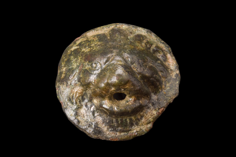 Ca. 100-200 AD.
A cast bronze phalera formed as a lion's mask. The animal's head...