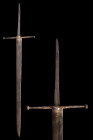 Ca. 1425-1450 AD.
An excellent forged-iron long sword with a broad blade tapering to a sharp point. The cross guard is of a ‘tommy bar’ type. The hilt...
