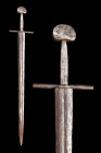 Ca. 1100 AD.
An iron sword with a distinctive Brazil nut pommel, Oakeshott as a type ‘A’. The cross guard is long, thin, and square sectioned, in Oake...
