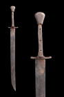 Ca. 1300-1400 AD.
An iron falchion with a single-edged, asymmetric blade, with a short back edge. Cf. Oakeshott, Ewart (1980). European Weapons and Ar...