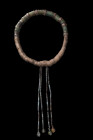 Ca. 900-1100 AD.
A women's diadem, meticulously crafted from a strand of tightly coiled bronze. The diadem's design incorporates a rather regular spac...