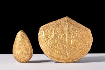Ca. 19th century AD.
A captivating pair of gold plaques: the first plaque, a diminutive teardrop in form, presents an exquisite scene – a decorative b...